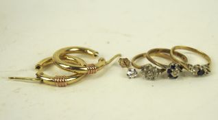 A group of three 9ct gold ladies rings and pair of 9ct gold hoop earrings,