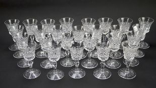 A quantity of small liqueur glasses, all with cut glass decoration,