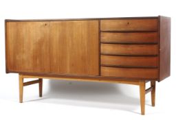 A mid century style teak lowboy.