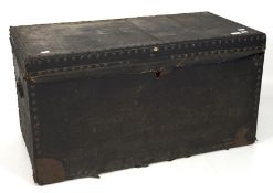 An early 20th century wood blanket box covered in black painted canvas fixed with studs,