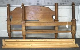 A 20th century double four poster bed and hangings, constructed of oak with curved headboards,