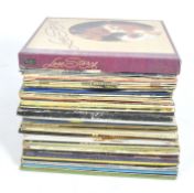 A collection of vintage vinyl records, featuring a variety of music to include Neil Diamond,