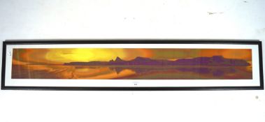 A framed photograph of landscape, depicting Marcus Hill, Wales at sunset,