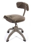 A Tansad industrial machinist's swivel chair on a metal four point base.