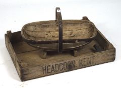 A vintage wooden seed tray and a wooden trug, the seed tray marked to sides 'Headcorn Kent',