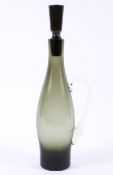 A vintage 1960s smoked grey/green glass decanter and stopper,