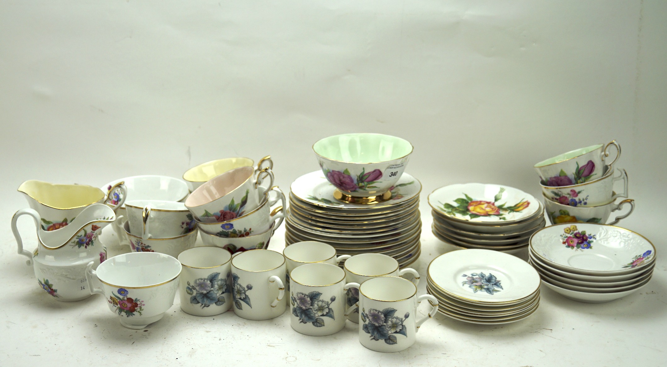 Three 20th century part tea services, including a Paragon set in the 'Peace' pattern,