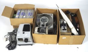 A vintage 35mm slide projector and a selection of photographic equipment and accessories,