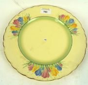 A Royal Staffordshire Pottery Honeyglaze Clarice Cliff plate, painted in the crocus pattern,