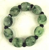 A vintage carved jade bead bracelet,