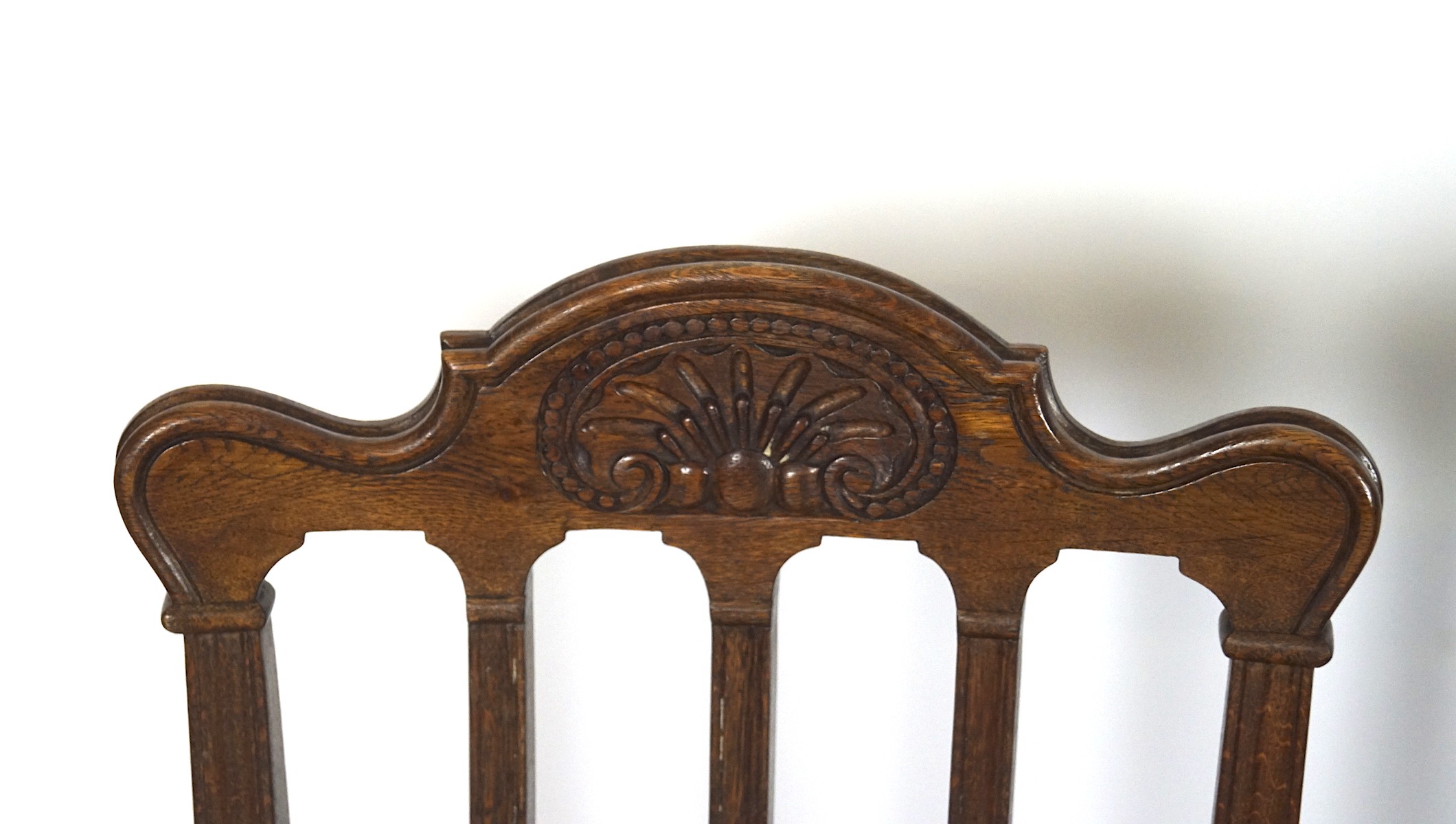 A set of four mid-century oak chairs, with shaped top and carved details, - Image 2 of 2