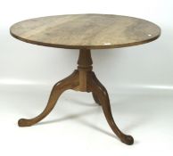 An early 20th century table, of circular form, raised upon tripod pedestal base, cabriole legs,