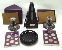 An assortment of collectables, to include a pair of silver plated candlesticks,