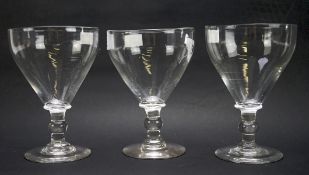 A set of three mid-19th century drinking glass rummers, each with cut pontil mark to underside,