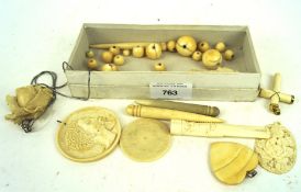 A collection of carved Ivory and bone jewellery, to include beads, cheroot holders,