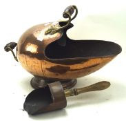 A late 19th/early 20th century brass coal scuttle, of hammered globular form,