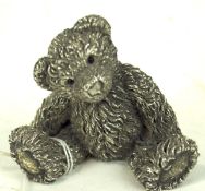 A modern 'Country Artists' hallmarked silver model of a teddy bear, in a seated pose,