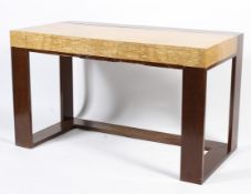 A contemporary desk or dressing table in blonde maple veneer