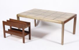 A mid century teak framed tile top coffee table with repeating abstract design,