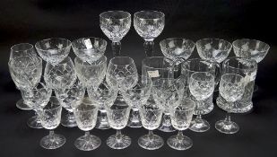 A collection of contemporary glassware with moulded decoration, including wine glasses,