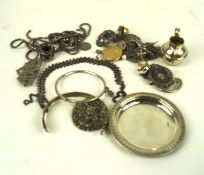 A selection of white metal wares and costume jewellery, including pendant on chain, dish,