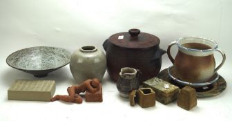 A collection of stoneware, including jugs, vases, dishes and more,