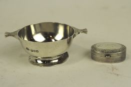 An early 20th century small Silver quaich and a silver pill pot,