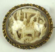 A Chinese, 19th century carved ivory scene of scholars at a table on a terrace,