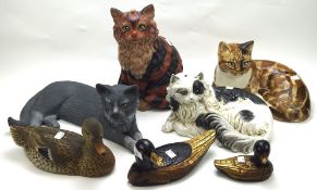 A collection of ceramic ducks and cats, including some studio pottery examples,