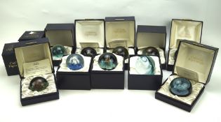 A collection of Caithness paperweights, of assorted styles and designs,