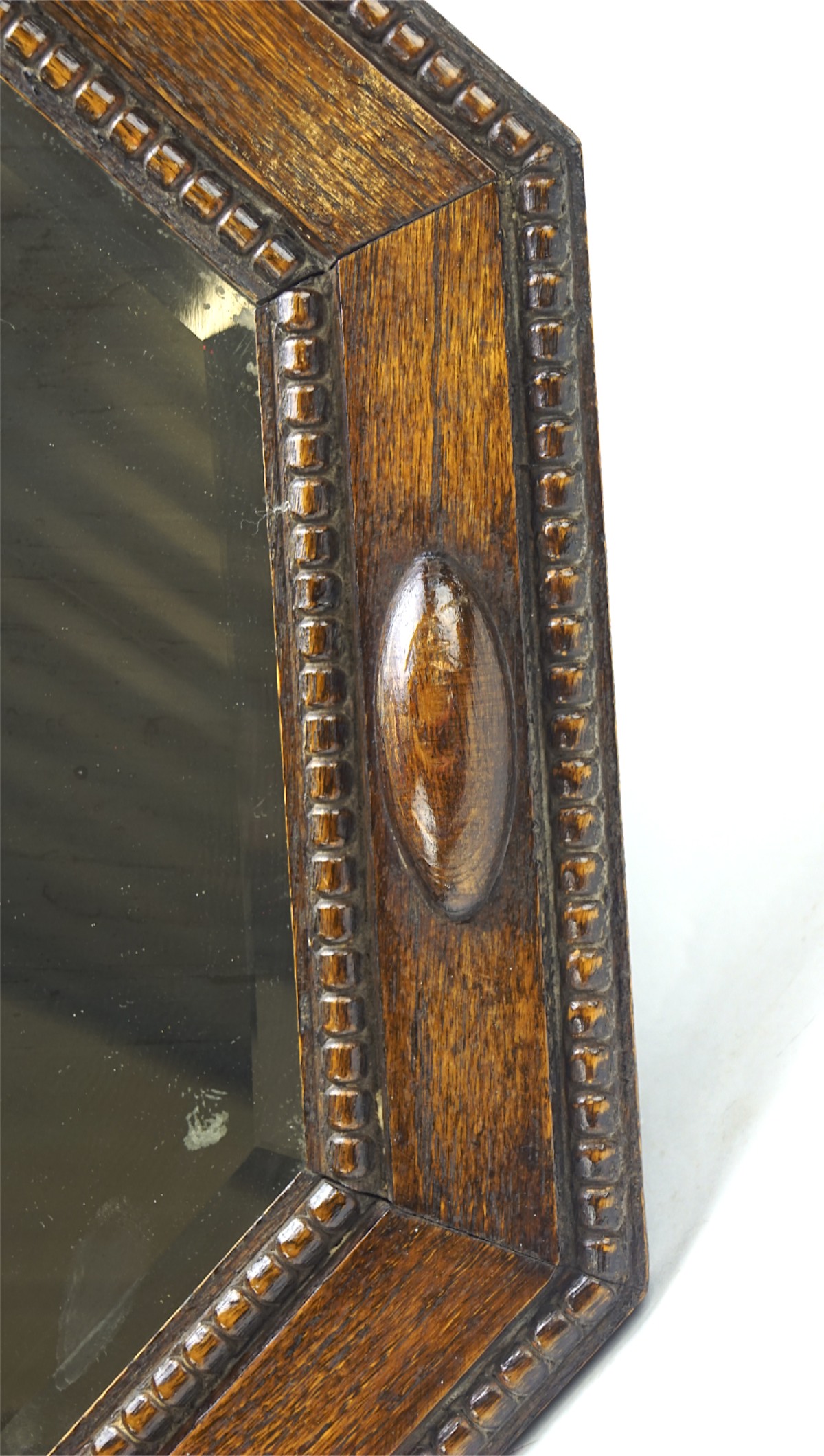 An early 20th century oak framed bevelled edge mirror, of octagonal form, - Image 2 of 2