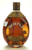 A vintage bottle of Dimple John Haig Whisky, mid century,