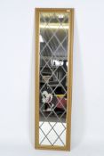 A late 20th century wall mirror, with simulated leaded panels, within moulded frame,