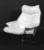 A retro white leather reclining chair with chrome tubular frame and five point star base.