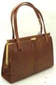 A Mappin and Webb lizard skin handbag, in brown with two handles,