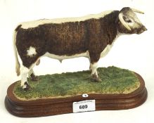 A modern Border fine arts figure depicting a cast resin Longhorn Bull, no B1138, mounted on stand,