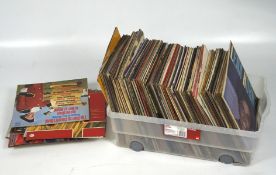 A large collection of vinyl records, including pop, jazz and classical music,