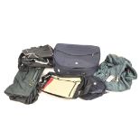 A collection of holdalls, of assorted colours and designs,