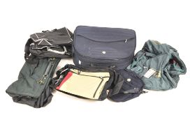 A collection of holdalls, of assorted colours and designs,