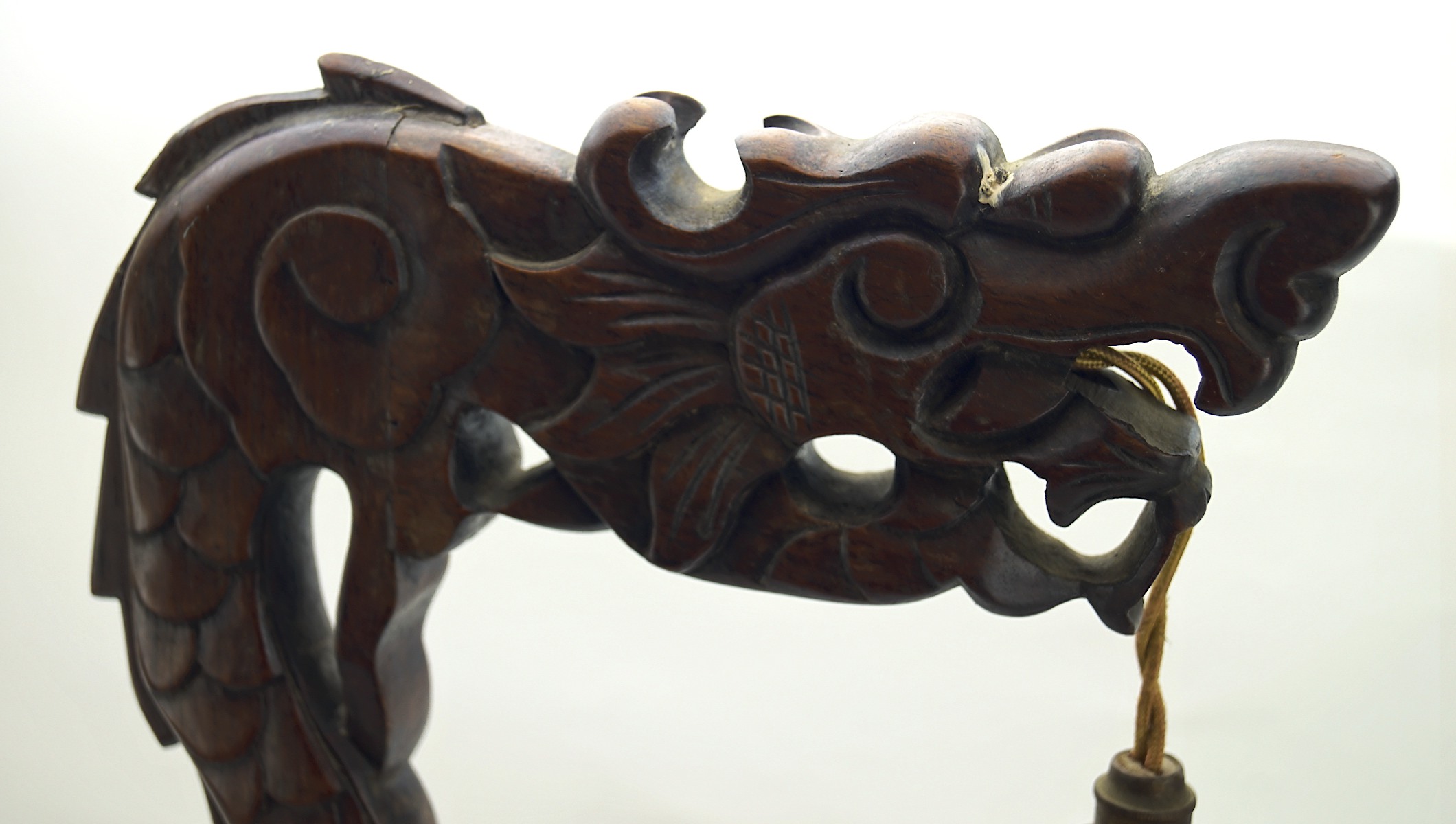 An early 20th century Chinese wooden table lamp, carved in the form of a dragon, on a circular base, - Image 2 of 2