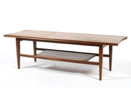 A mid century teak oblong coffee table in the style of Gordon Russell