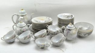 A Japanese eggshell part tea service, all decorated with flowers and blossoms,