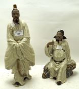 Two ceramic figures modelled as Chinese gentlemen,
