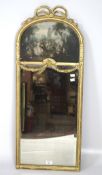 A gilt framed wall mirror in the French 18th century style, of vertical form with domed top,