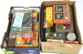 A collection of vintage board games, including a travelling chess set, Trivial Pursuit,