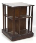 A mahogany open square bookcase with fluted uprights, on wheels, 71cm x 50.5cm x 50.