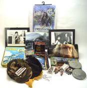 A collection of film and TV related items, including Lord of The Rings posters,