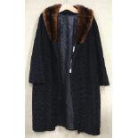 A ladies 1950's black Astra fur coat with a brown fur collar,