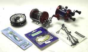 A group of three fishing reels, to include an Abu,
