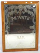 A 'Private Bar' etched mirror, decorated with vines and motifs, within a wooden frame,